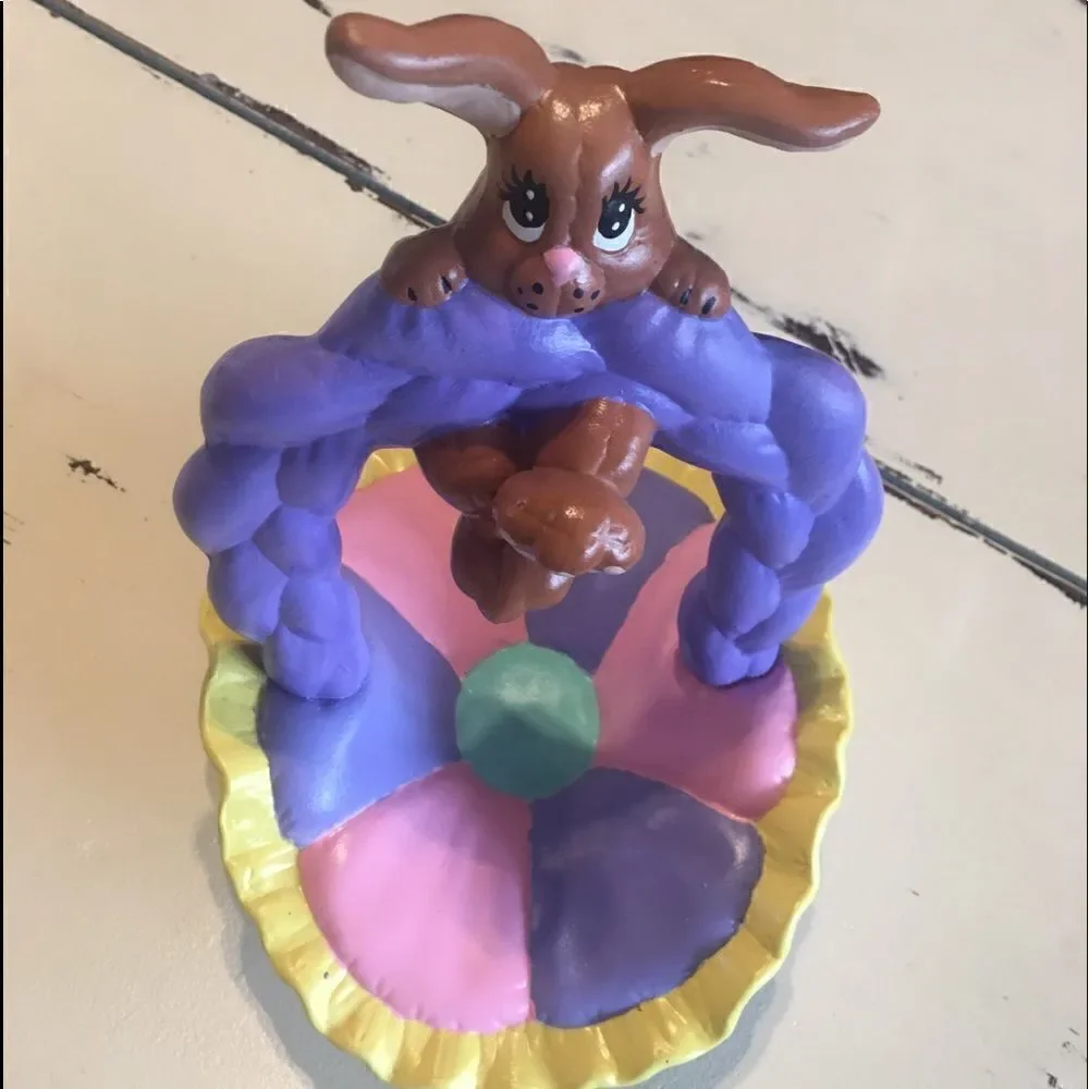 Ceramic Easter bunny hanging from basket